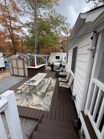 a view of a roof deck with furniture