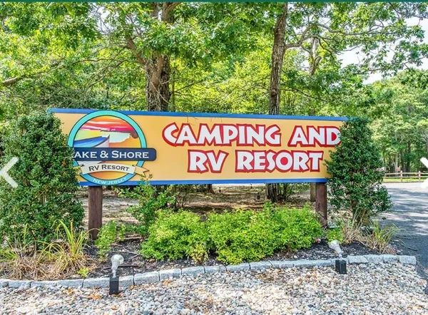 a view of a patio with table and chairs