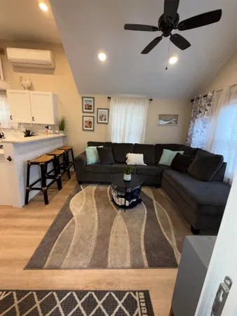 a room with a bed and a dresser