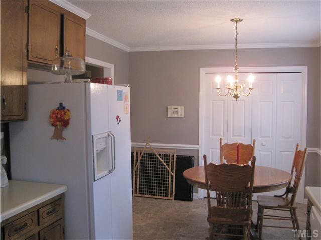 405 Wilson Jones Road Clayton, NC 27520 - Photo 11 of 16 Kitchen/breakfast room/chair rail/crown molding.