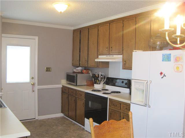 405 Wilson Jones Road Clayton, NC 27520 - Photo 5 of 16 More cabinets/stove/vent hood