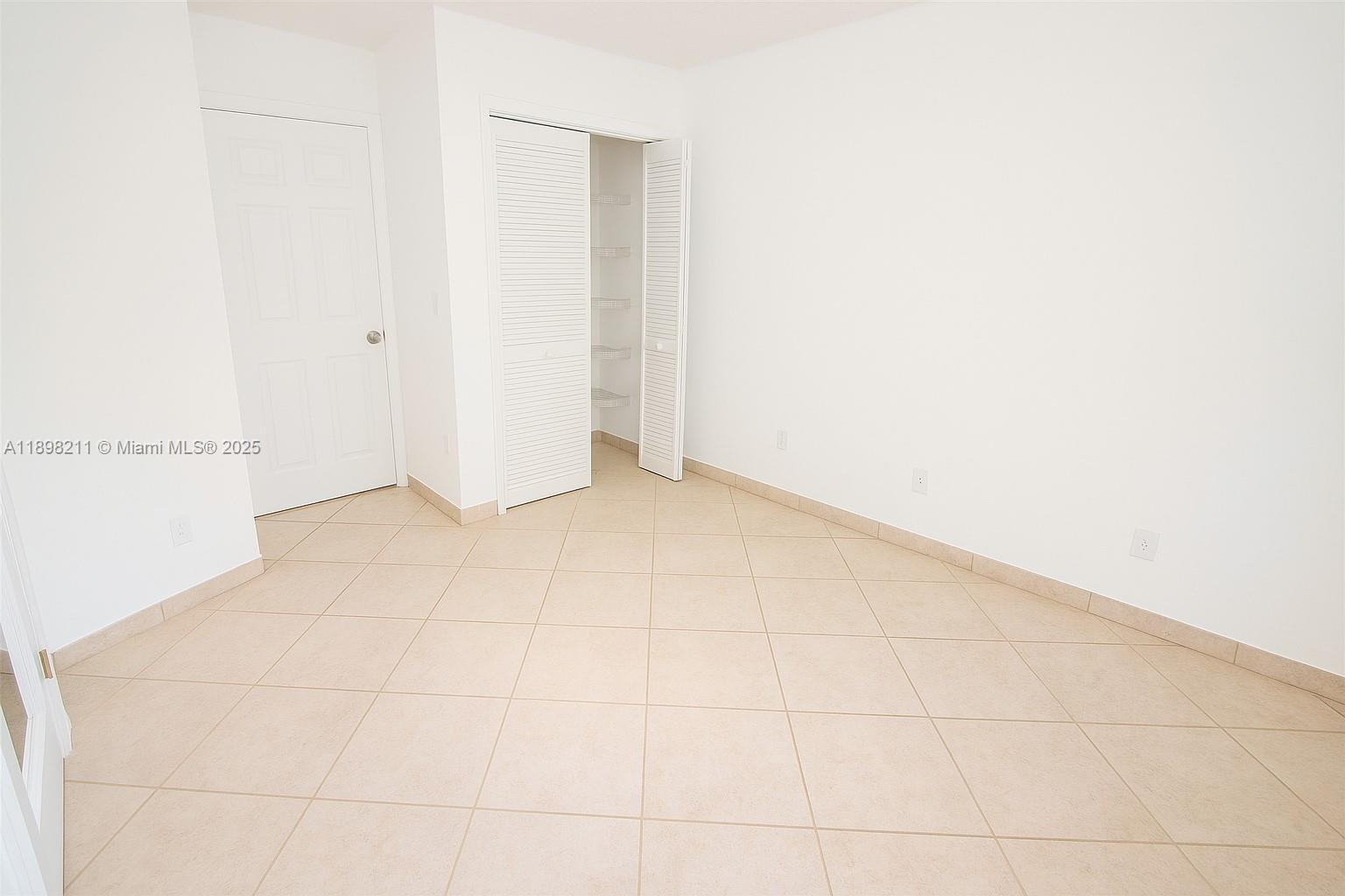 14478 Southwest 139th Ave Circle West, Unit 14478 Miami, FL 33186 - Photo 12 of 25 a view of an empty room