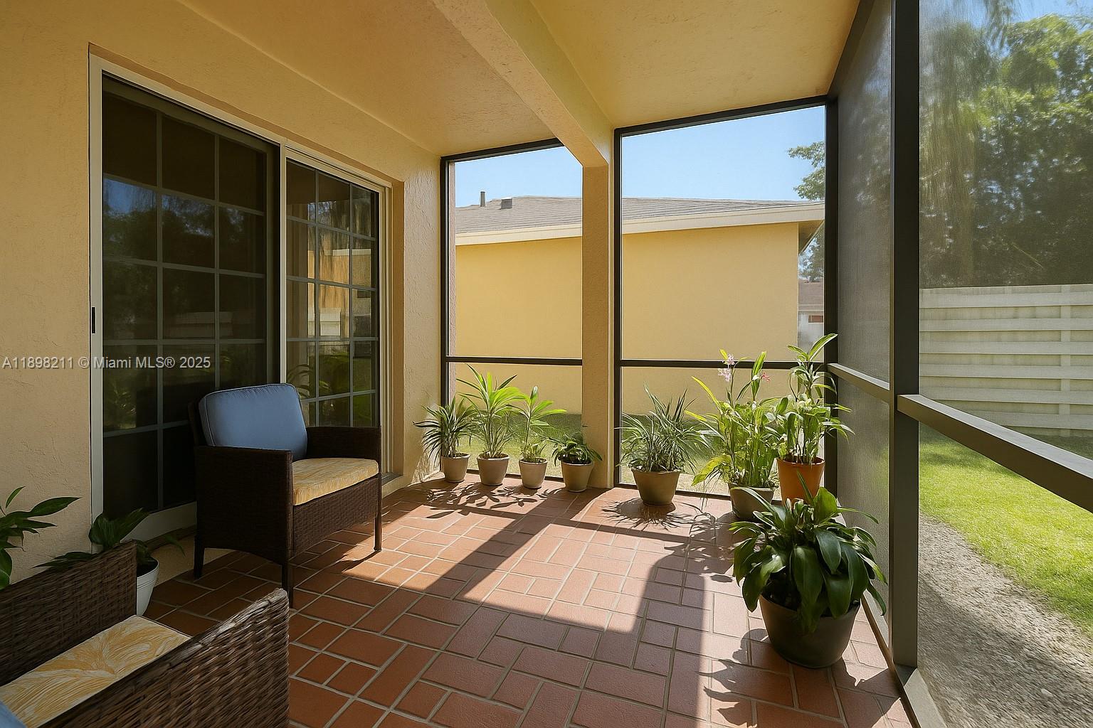 14478 Southwest 139th Ave Circle West, Unit 14478 Miami, FL 33186 - Photo 18 of 25 a living room filled with furniture and a potted plant