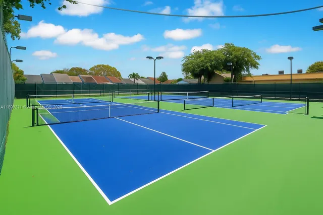 a view of an outdoor space and basketball court
