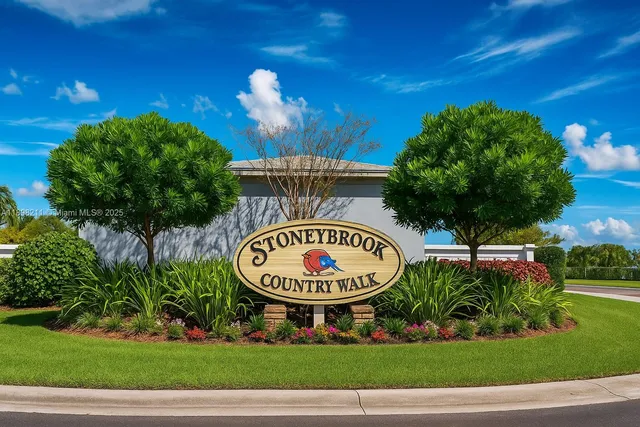 a view of a swimming pool with a house in the background