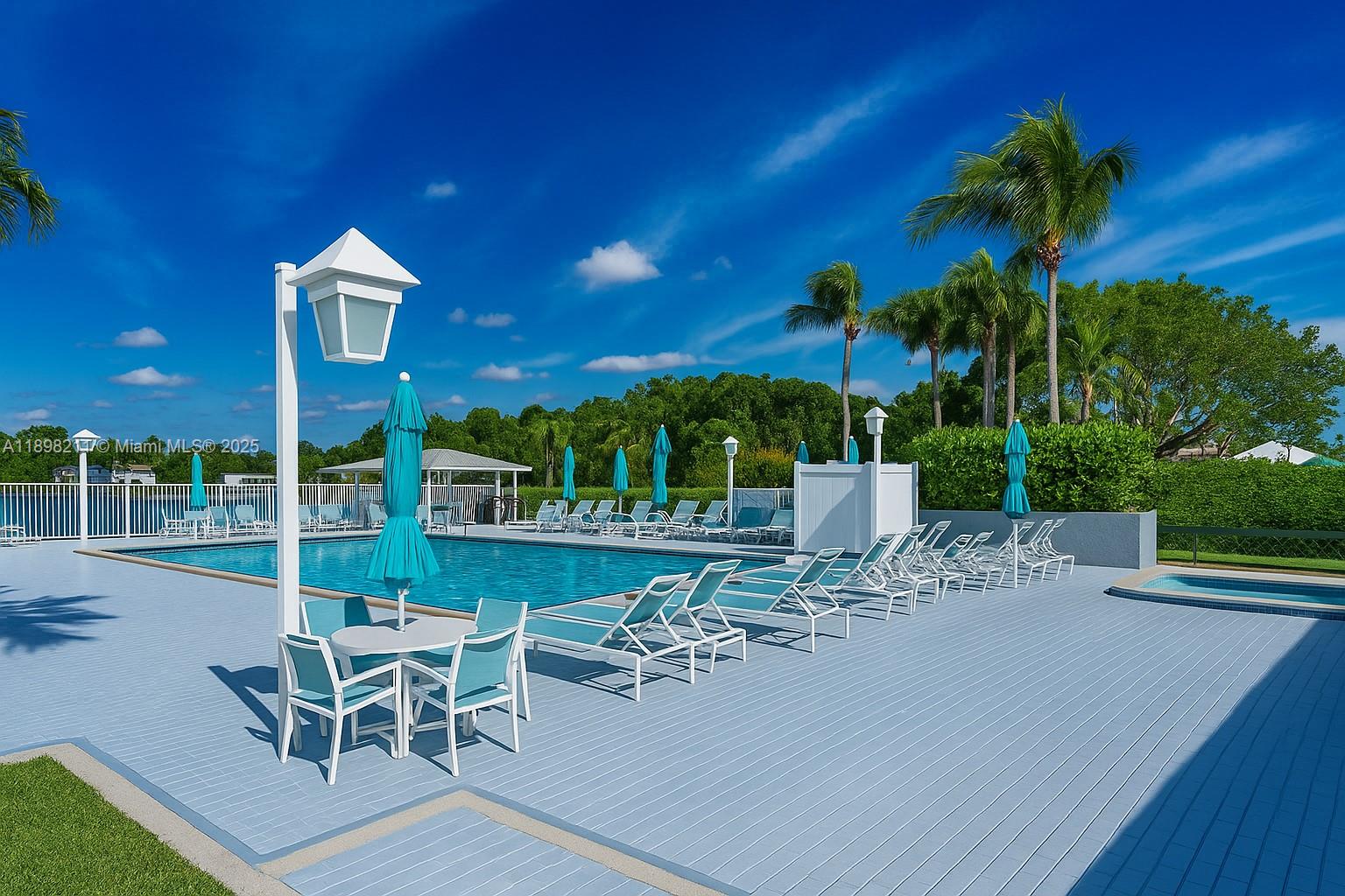 14478 Southwest 139th Ave Circle West, Unit 14478 Miami, FL 33186 - Photo 25 of 25 a view of a patio with a table and chairs