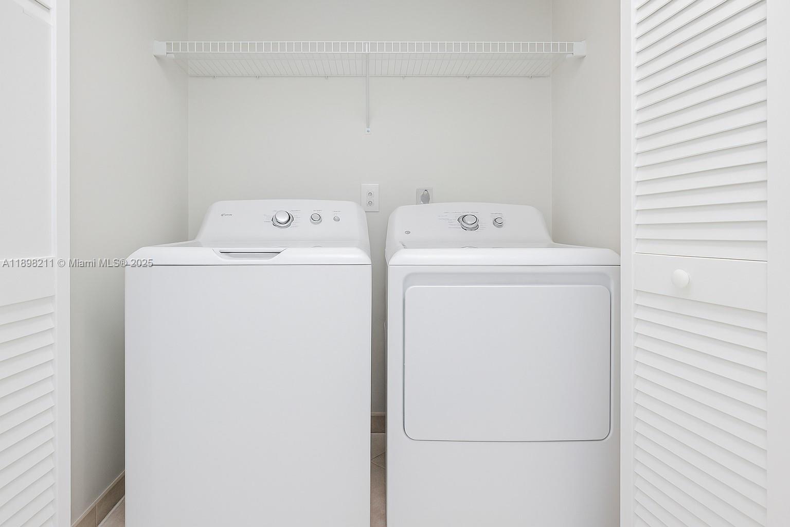 14478 Southwest 139th Ave Circle West, Unit 14478 Miami, FL 33186 - Photo 10 of 25 a utility room with dryer and washer