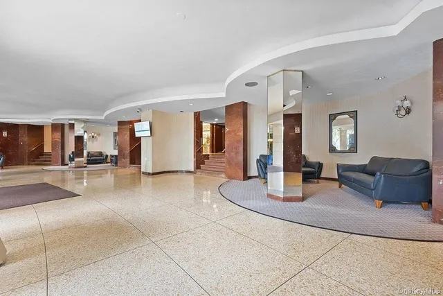 a living room with furniture and a table