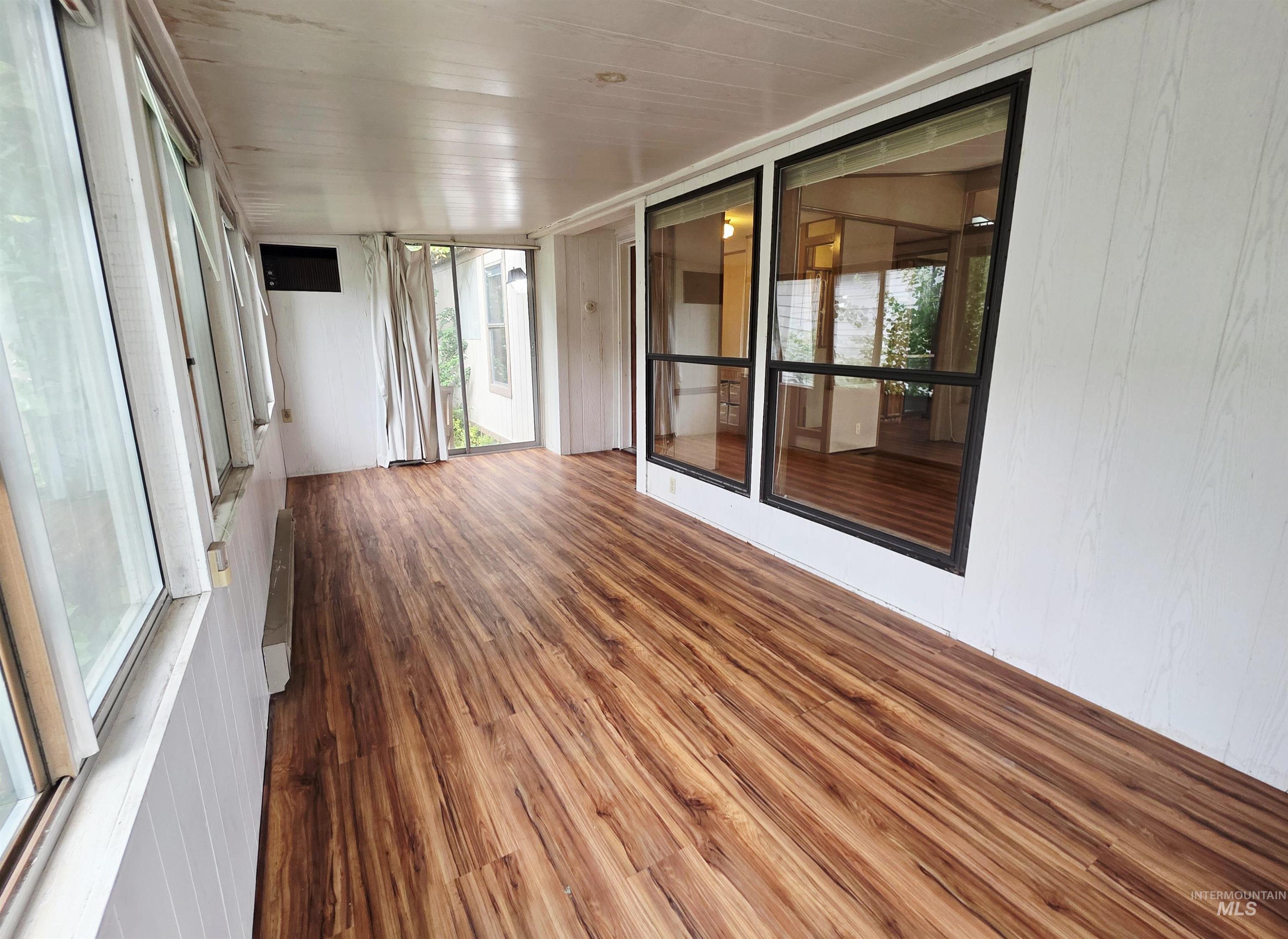 2015 6th Avenue, Unit 14 Clarkston, WA 99403 - Photo 3 of 27 Unfurnished sunroom featuring wood finished floors