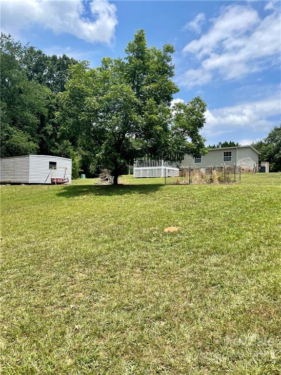 1255 Colonial Road Clover, SC 29710 - Photo 20 of 20 a view of a green yard with a building