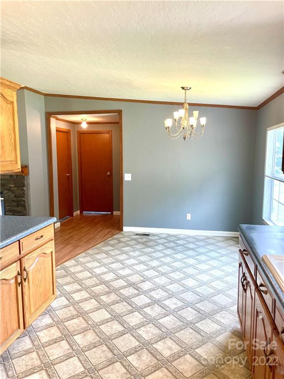 1255 Colonial Road Clover, SC 29710 - Photo 5 of 20 a view of a livingroom with a chandelier fan and kitchen view