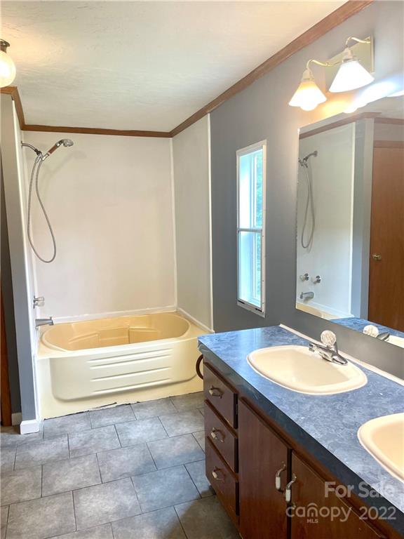 1255 Colonial Road Clover, SC 29710 - Photo 8 of 20 a bathroom with a granite countertop sink and a mirror