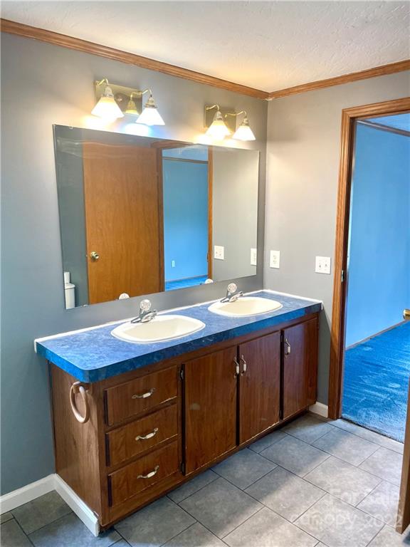 1255 Colonial Road Clover, SC 29710 - Photo 9 of 20 a bathroom with a granite countertop sink and mirror