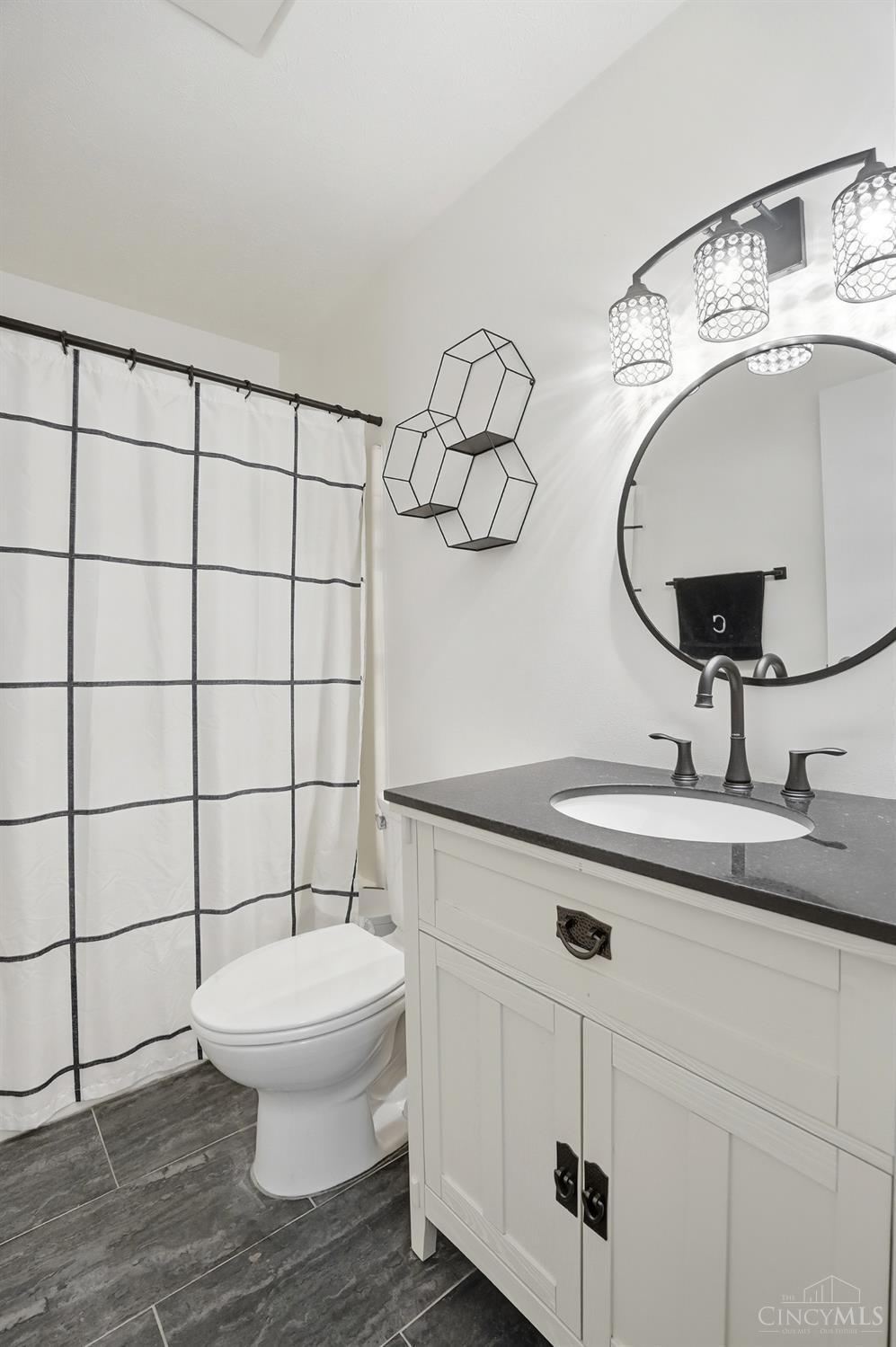 5654 Cheviot Road, Unit 1 Cincinnati, OH 45247 - Photo 19 of 36 Updated 2nd Floor Full Bath '22 - New Ceramic Tile Floor, New Vanity with Granite, New Fixtures and Hardware and New Toilet. Freshly Painted '25