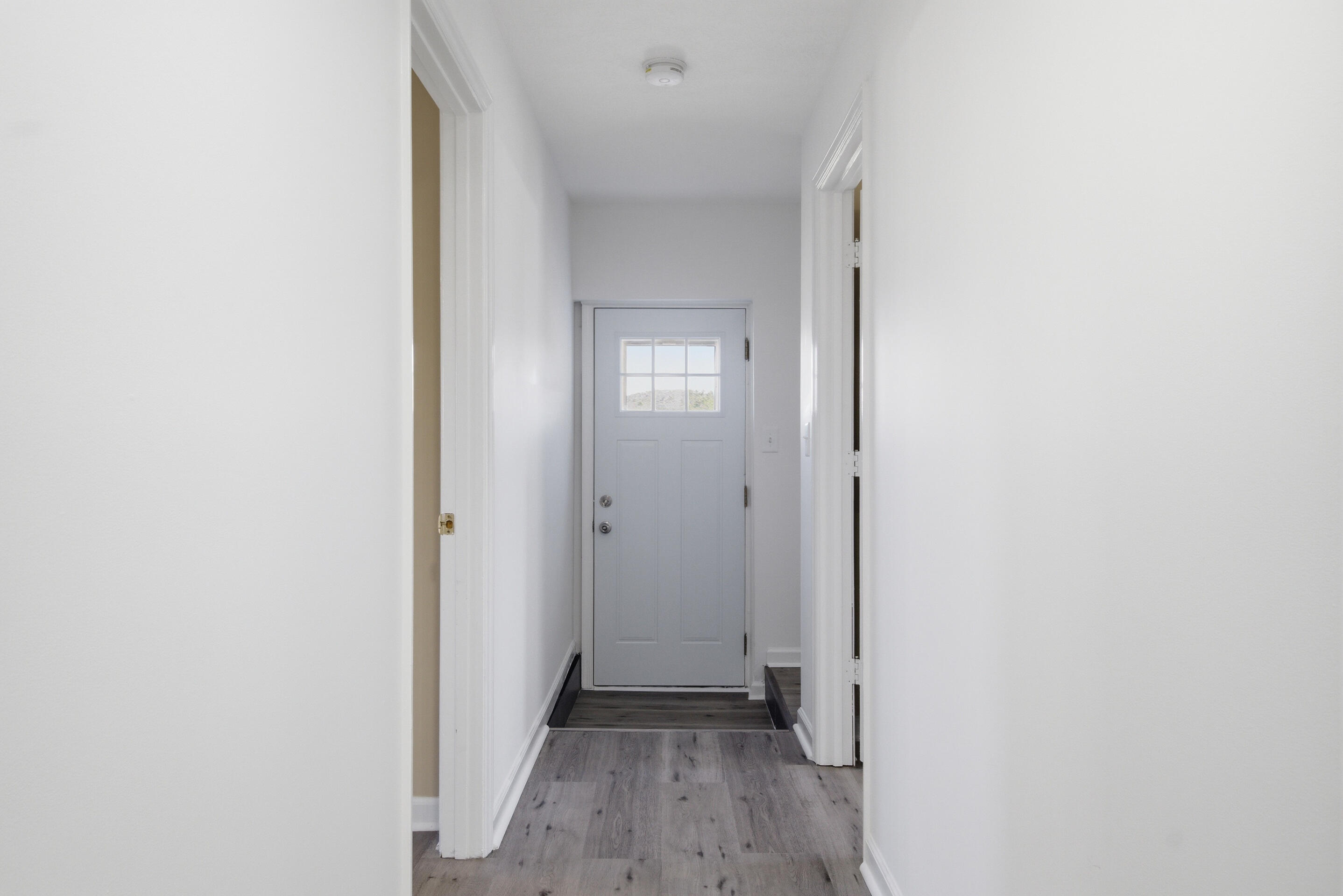 6458 Piney Woods Road Riner, VA 24149 - Photo 14 of 50 a view of a hallway with wooden floor