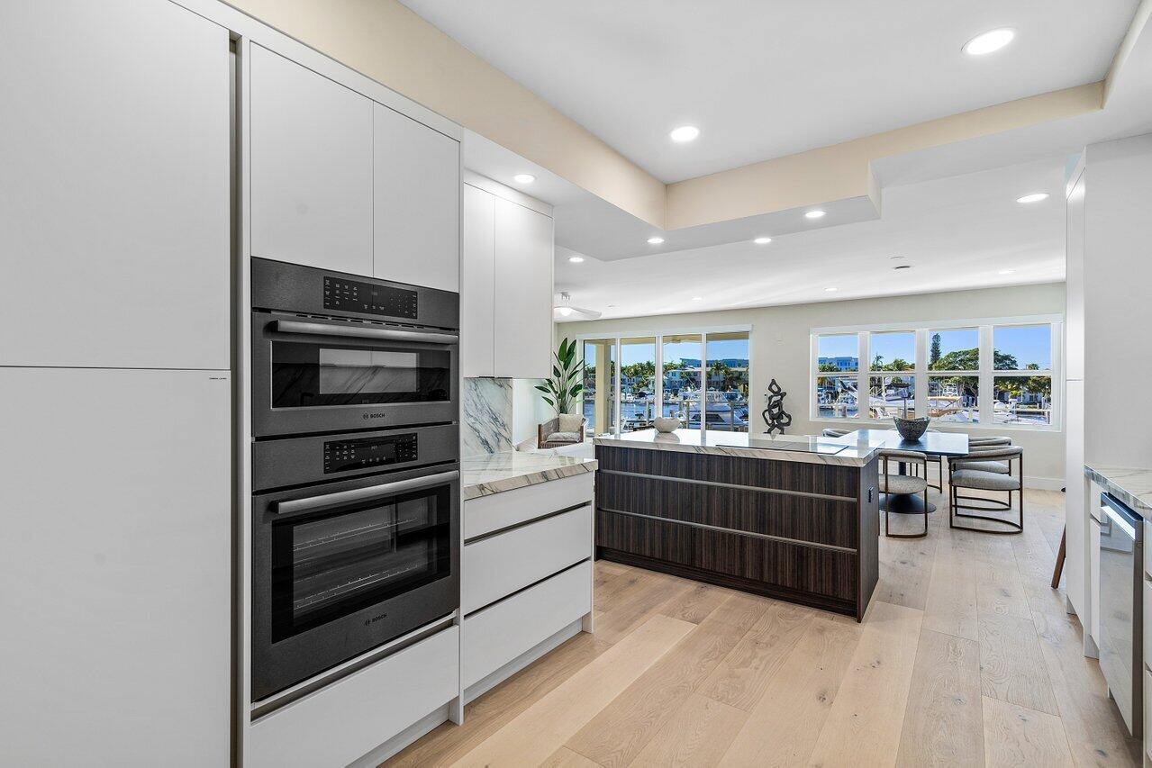 100 Mac Farlane Drive, Unit 2A Delray Beach, FL 33483 - Photo 12 of 28 a kitchen with sink and cabinets