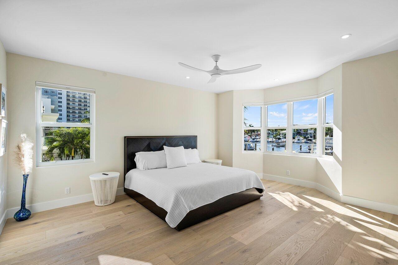 100 Mac Farlane Drive, Unit 2A Delray Beach, FL 33483 - Photo 16 of 28 a spacious bedroom with a large bed and a window