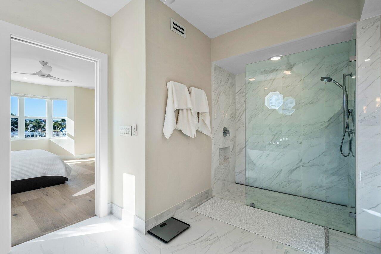 100 Mac Farlane Drive, Unit 2A Delray Beach, FL 33483 - Photo 18 of 28 a bathroom with a shower and a sink