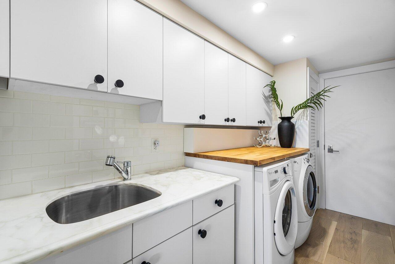 100 Mac Farlane Drive, Unit 2A Delray Beach, FL 33483 - Photo 26 of 28 a utility room with dryer and washer