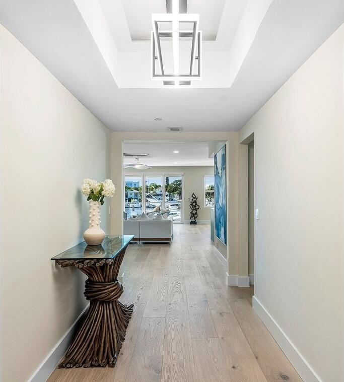 100 Mac Farlane Drive, Unit 2A Delray Beach, FL 33483 - Photo 4 of 28 a view of a hallway to dining room with furniture and wooden floor