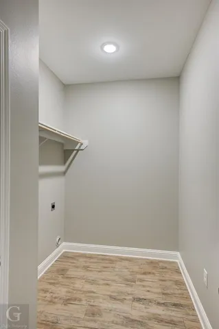 a view of a kitchen with a sink a refrigerator and window