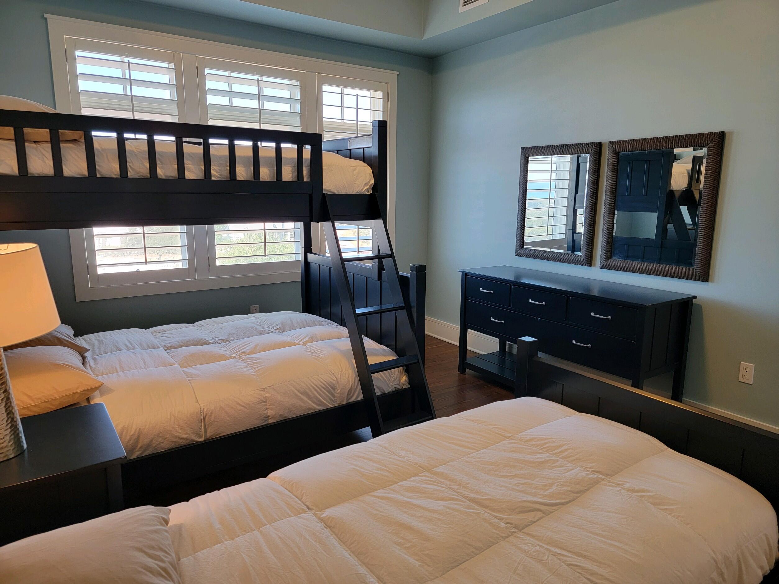 99 Compass Point Way South, Unit 402 Inlet Beach, FL 32461 - Photo 13 of 36 a bedroom with a bed and a large window
