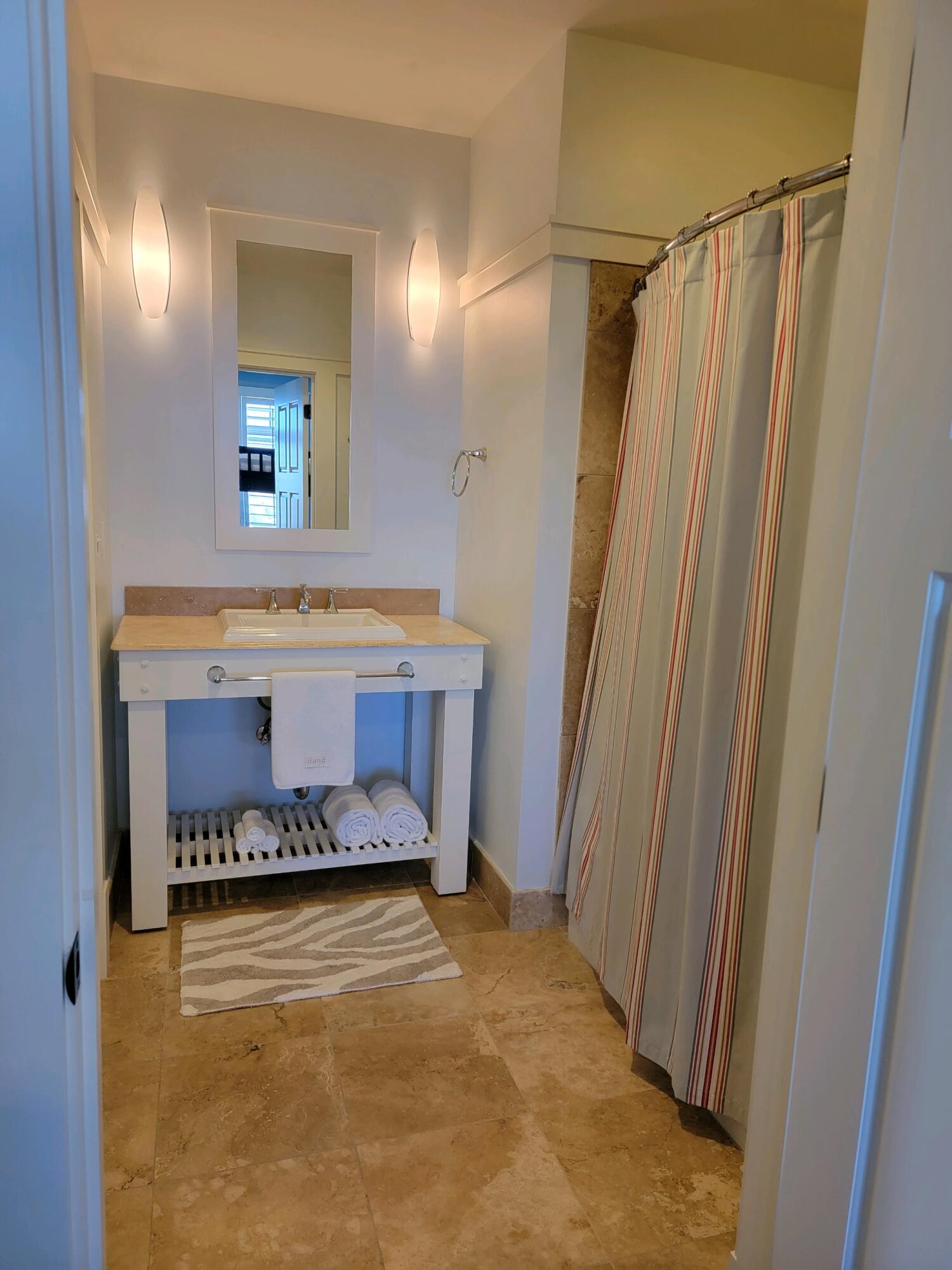 99 Compass Point Way South, Unit 402 Inlet Beach, FL 32461 - Photo 14 of 36 a bathroom with a tub and a sink
