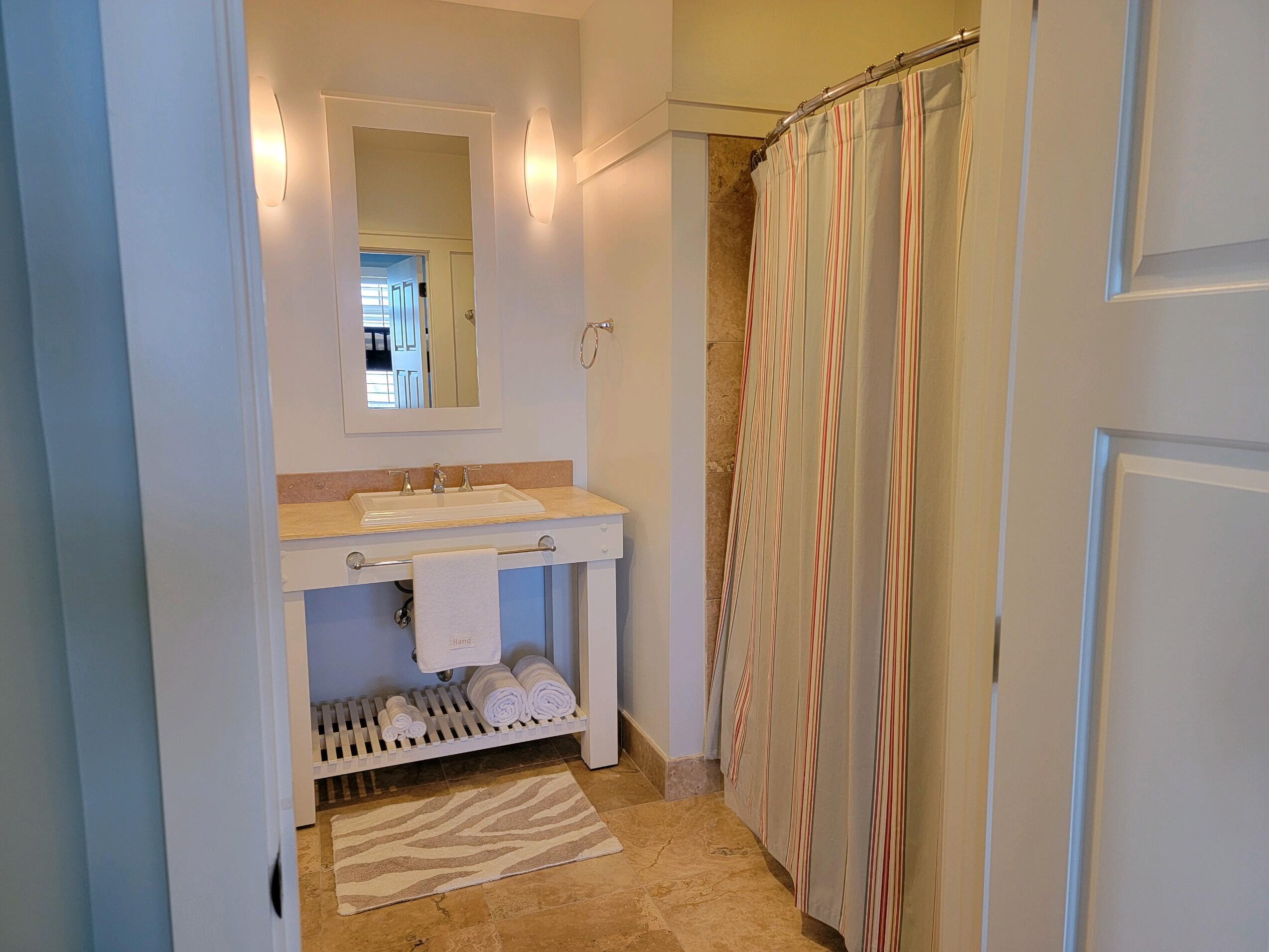 99 Compass Point Way South, Unit 402 Inlet Beach, FL 32461 - Photo 15 of 36 a bathroom with a sink and a mirror