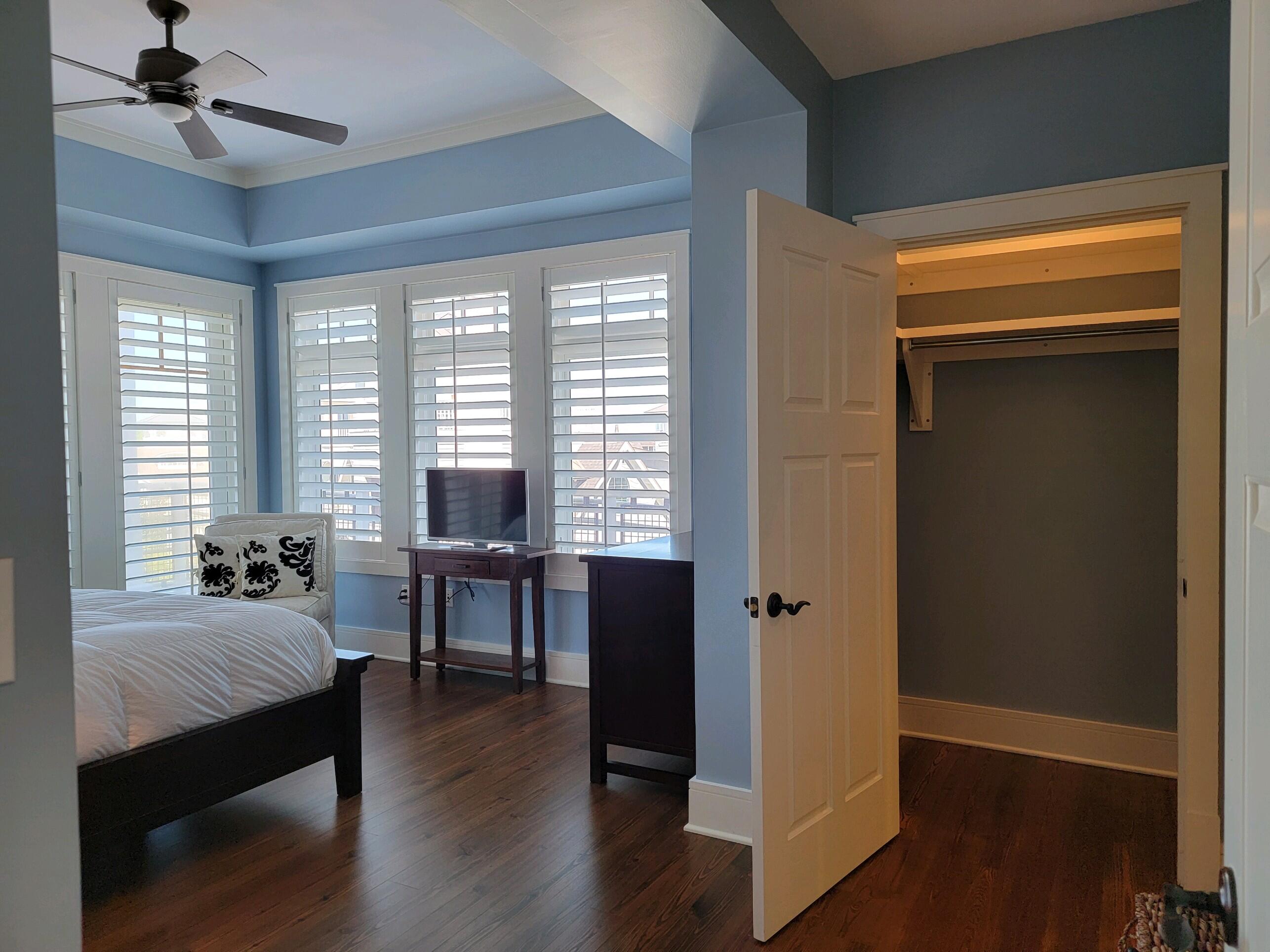 99 Compass Point Way South, Unit 402 Inlet Beach, FL 32461 - Photo 22 of 36 a bedroom with bed and a window