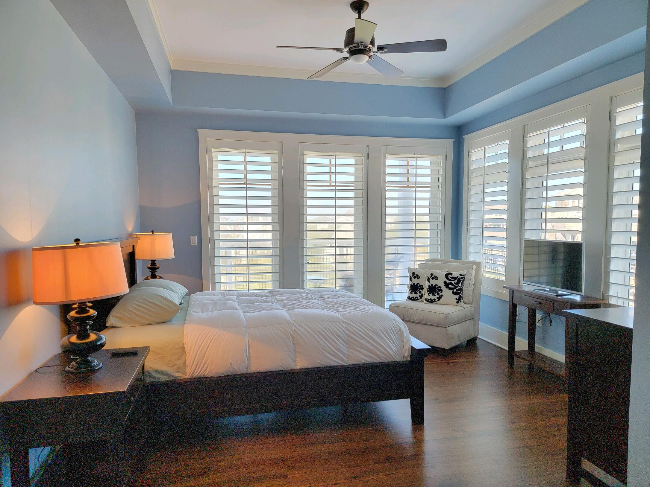 99 Compass Point Way South, Unit 402 Inlet Beach, FL 32461 - Photo 25 of 36 a bedroom with bed and window