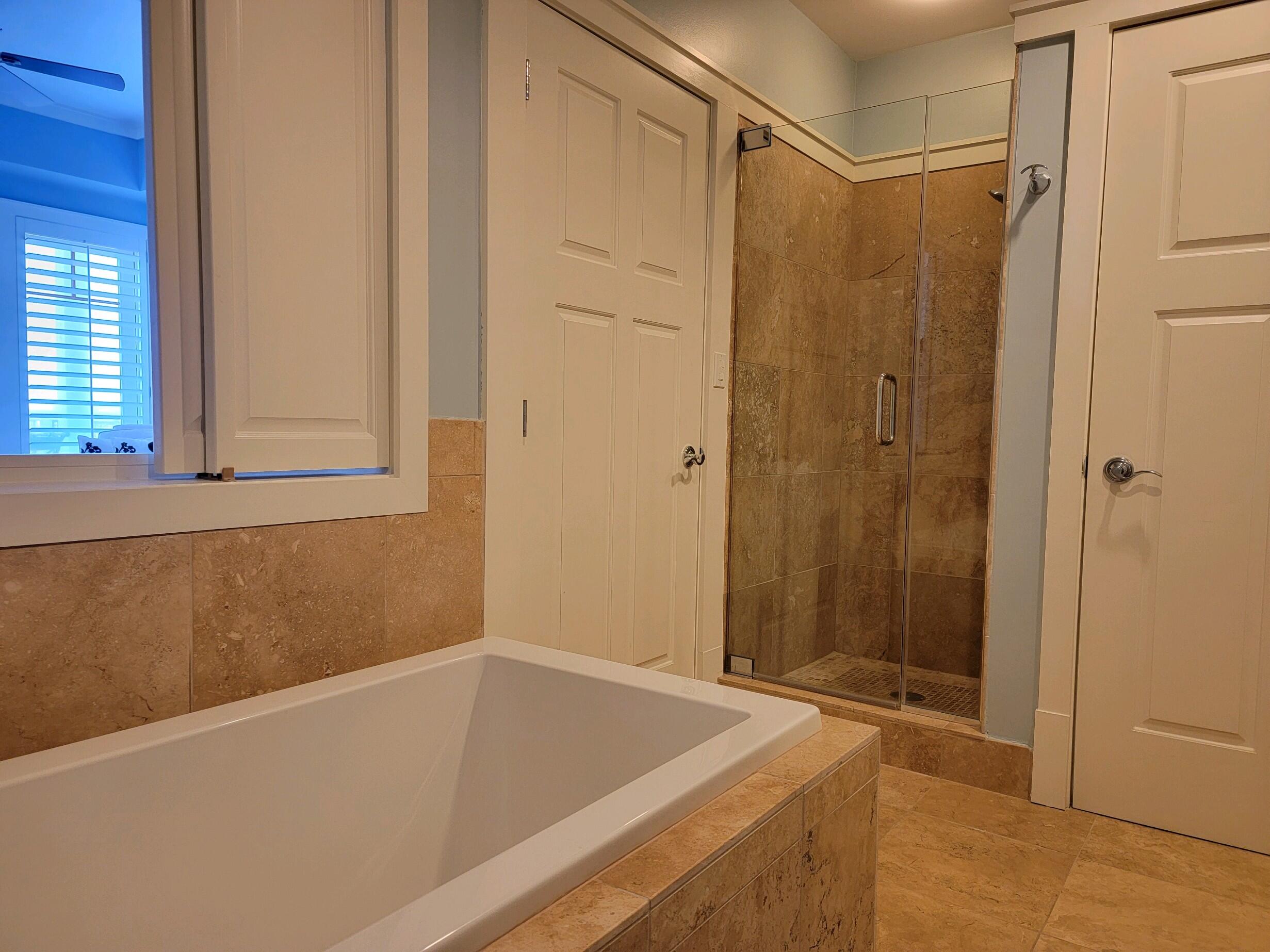 99 Compass Point Way South, Unit 402 Inlet Beach, FL 32461 - Photo 29 of 36 a bathroom with a tub and a shower