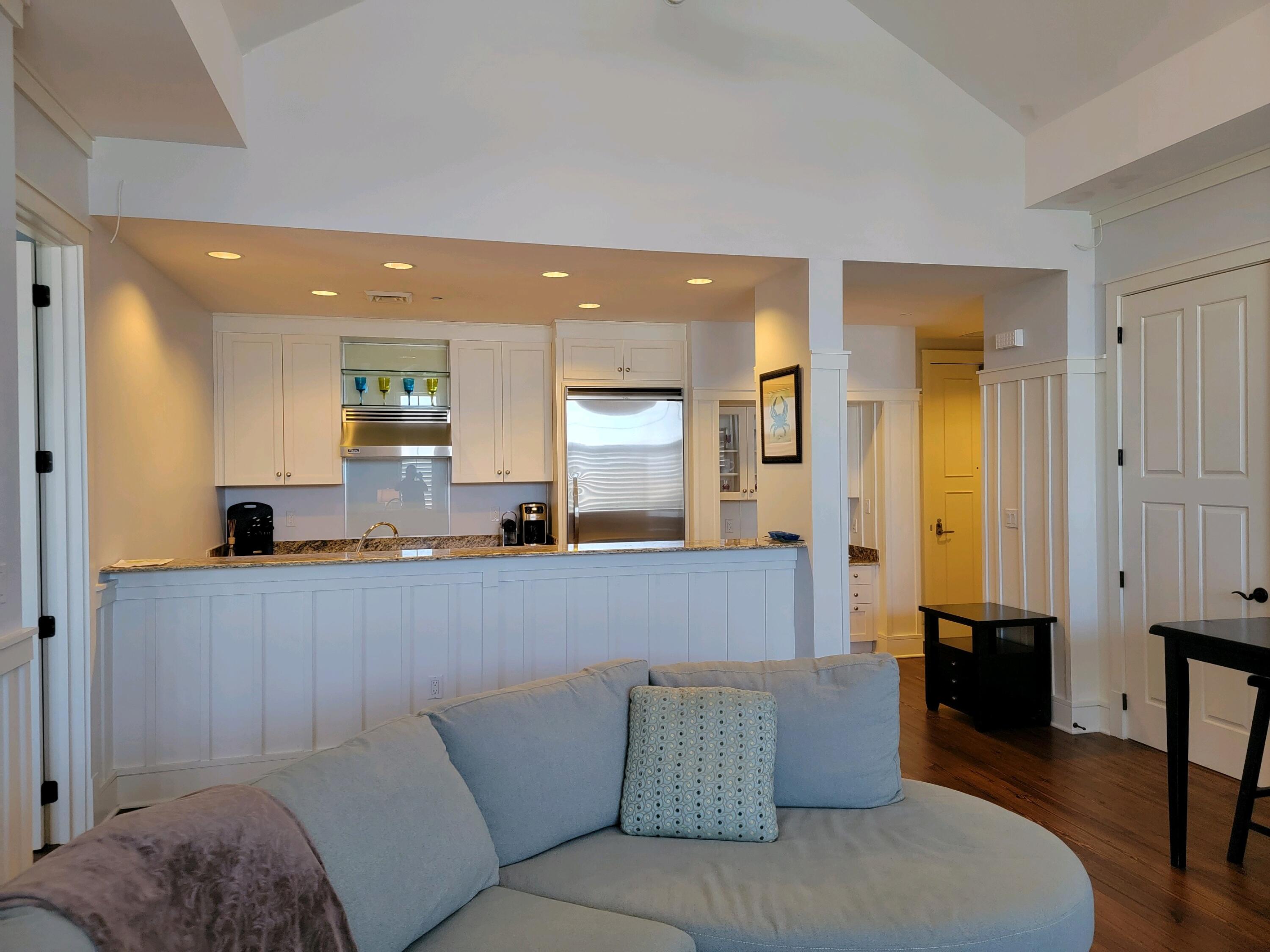 99 Compass Point Way South, Unit 402 Inlet Beach, FL 32461 - Photo 32 of 36 a living room with furniture and a wooden floor
