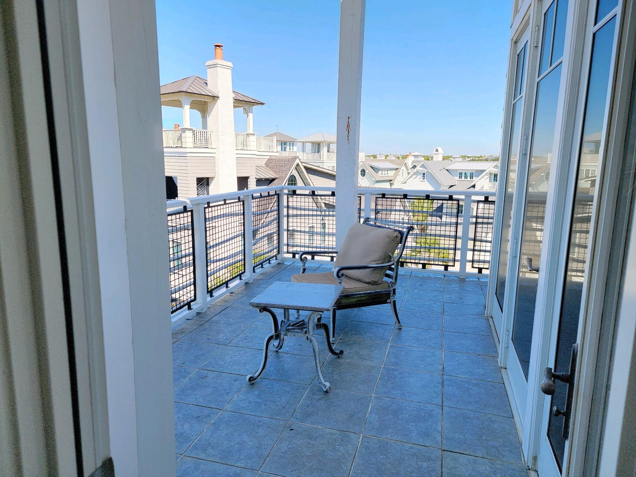 99 Compass Point Way South, Unit 402 Inlet Beach, FL 32461 - Photo 7 of 36 a view of a dining room with furniture window and wooden floor