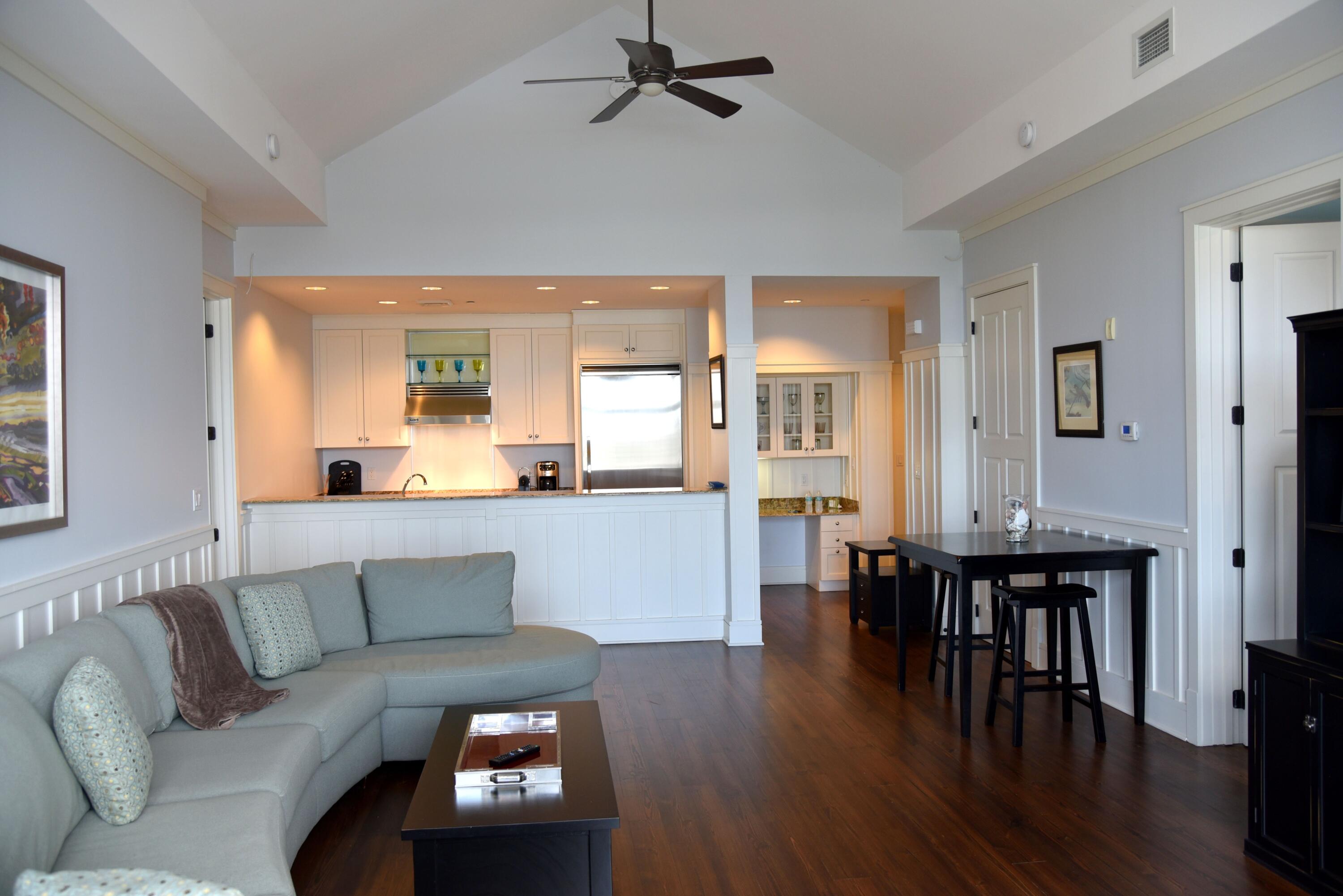 99 Compass Point Way South, Unit 402 Inlet Beach, FL 32461 - Photo 8 of 36 a living room with furniture and wooden floor