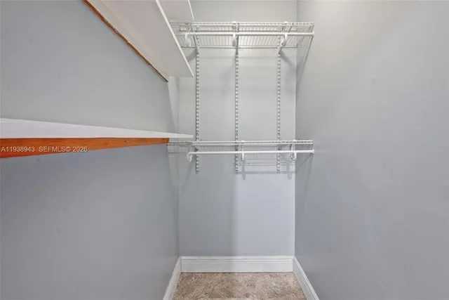 a view of a storage and utility room with washer and dryer
