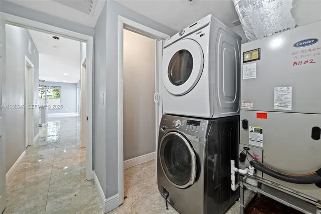 a view of a hallway view with wooden floor and staircase
