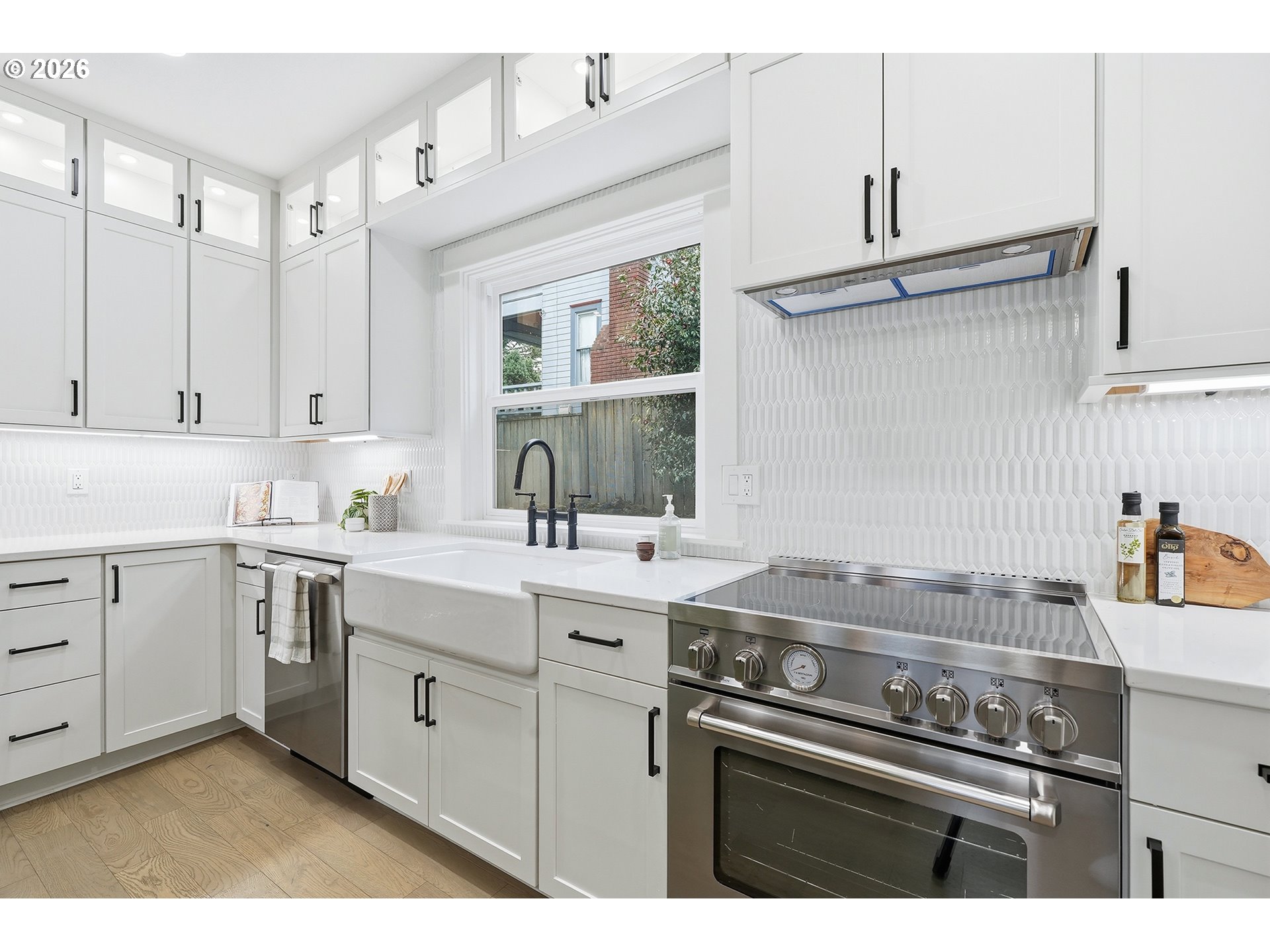 2125 Northwest 33rd Avenue Portland, OR 97210 - Photo 16 of 46 a kitchen with a sink stove and cabinets