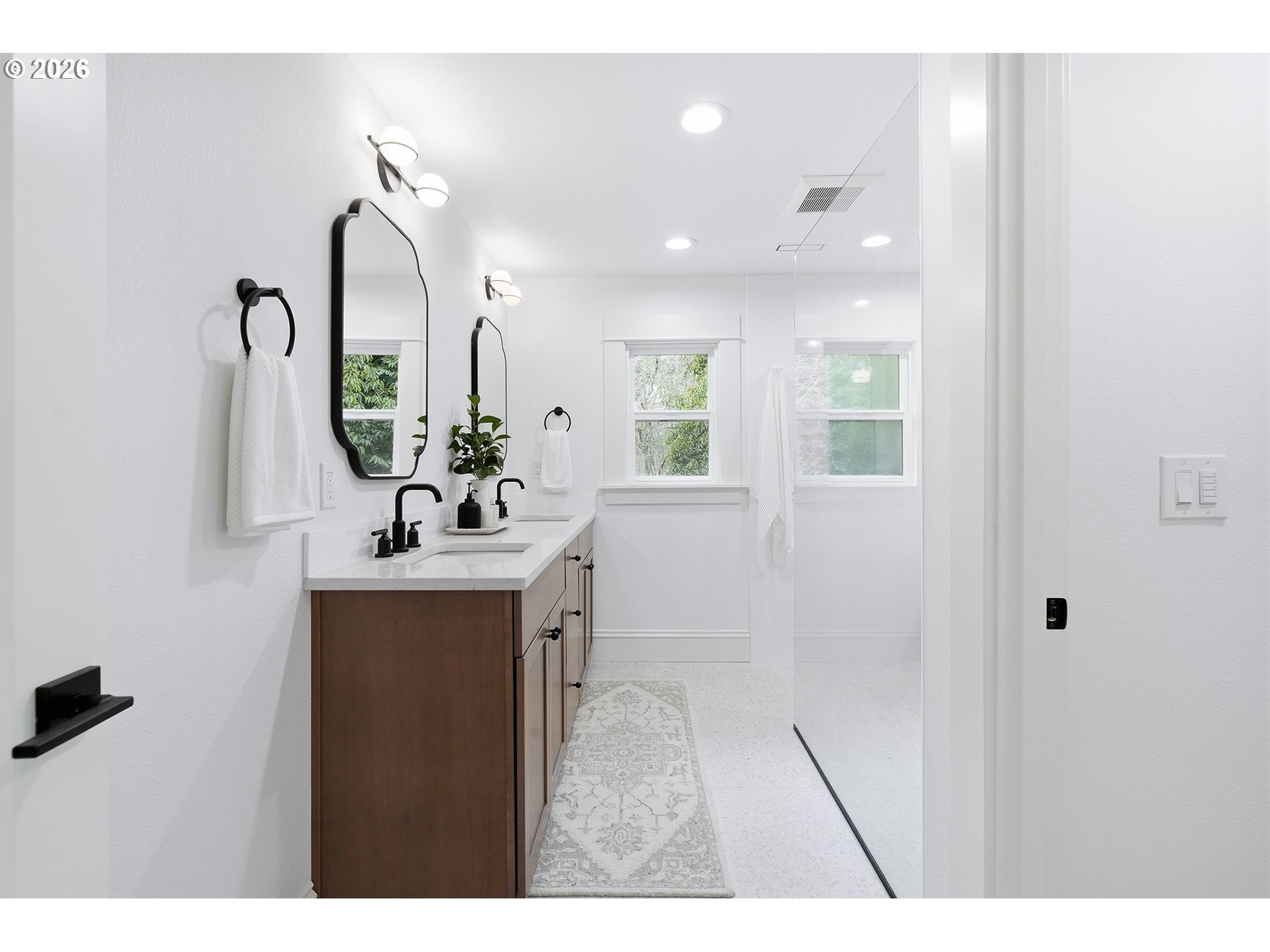 2125 Northwest 33rd Avenue Portland, OR 97210 - Photo 22 of 46 a bathroom with a sink a toilet and mirror
