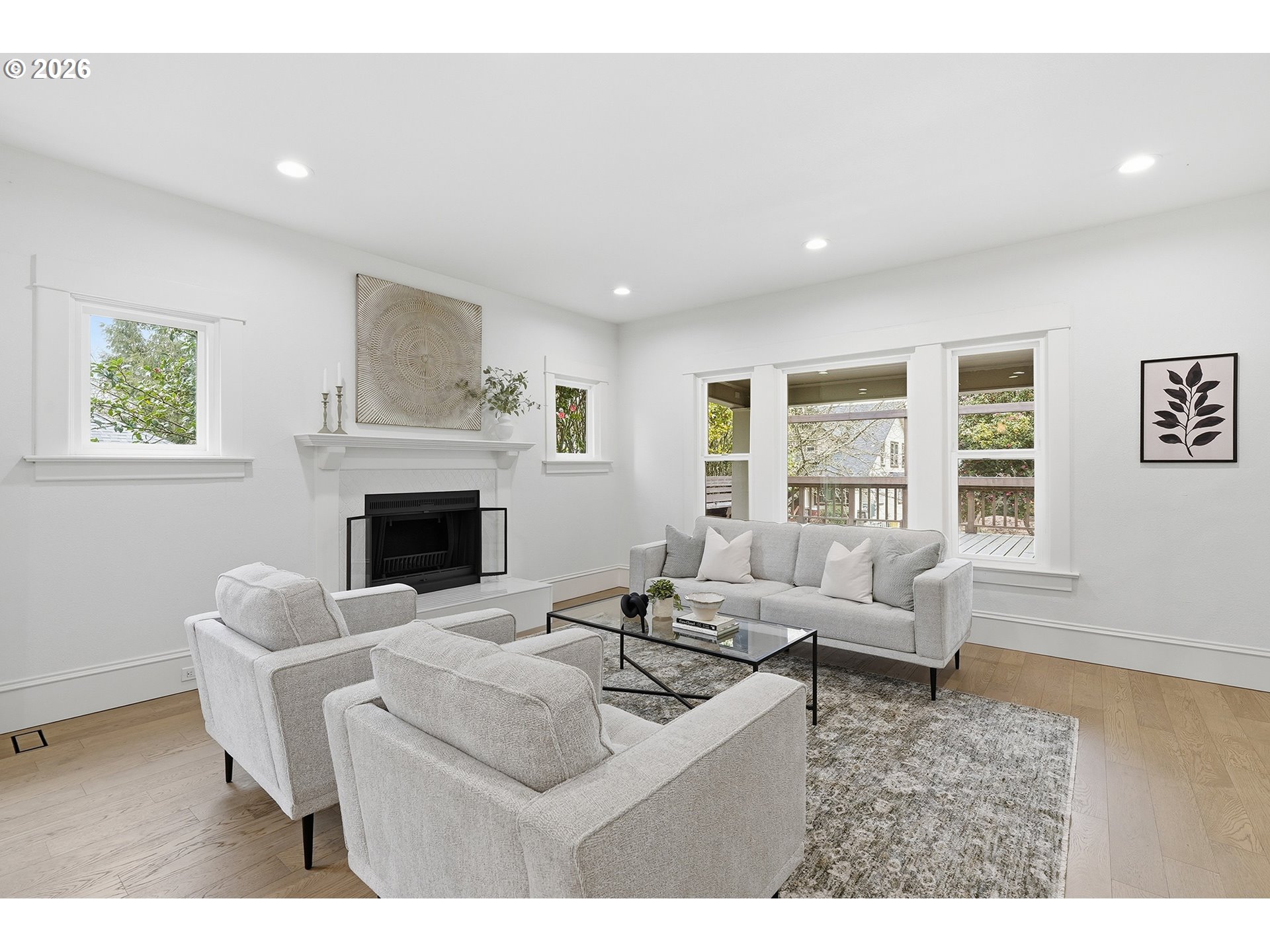 2125 Northwest 33rd Avenue Portland, OR 97210 - Photo 9 of 46 a living room with furniture a fireplace and a table