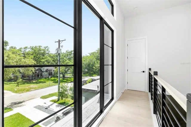 a couple of cars parked in front of a house
