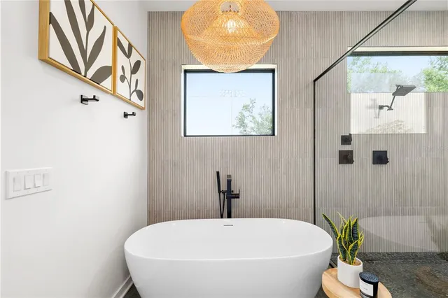 a balcony with furniture and a potted plant