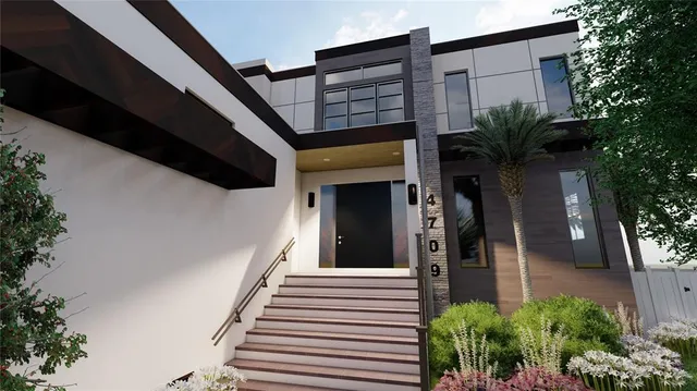 a view of a house with a potted plant and stairs
