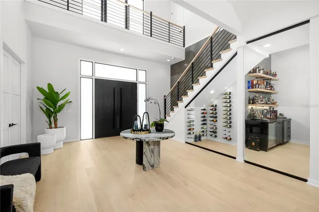 a view of entryway with furniture and stairs