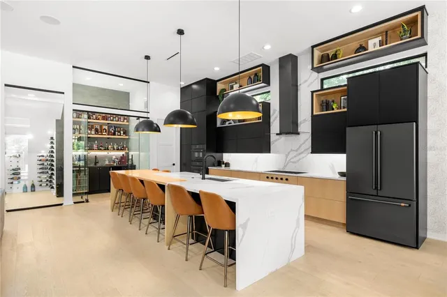 a kitchen with a refrigerator and cabinets