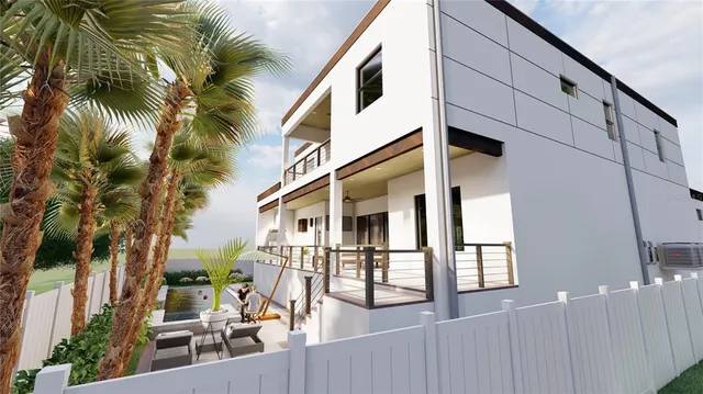 a view of a living room with furniture and a kitchen