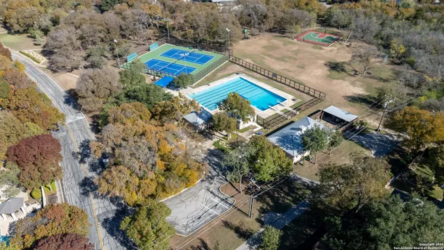 an aerial view of a house swimming pool and outdoor space