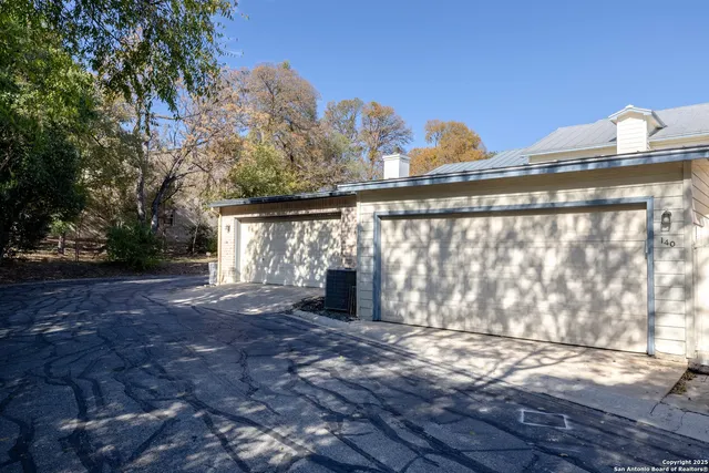 a view of a yard with a tree