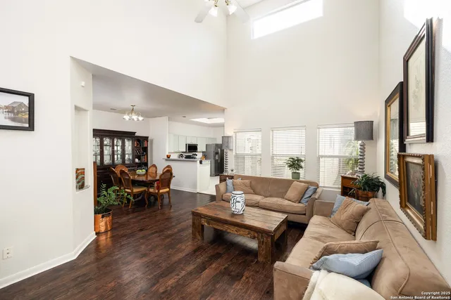 a living room with furniture wooden floor and a fireplace