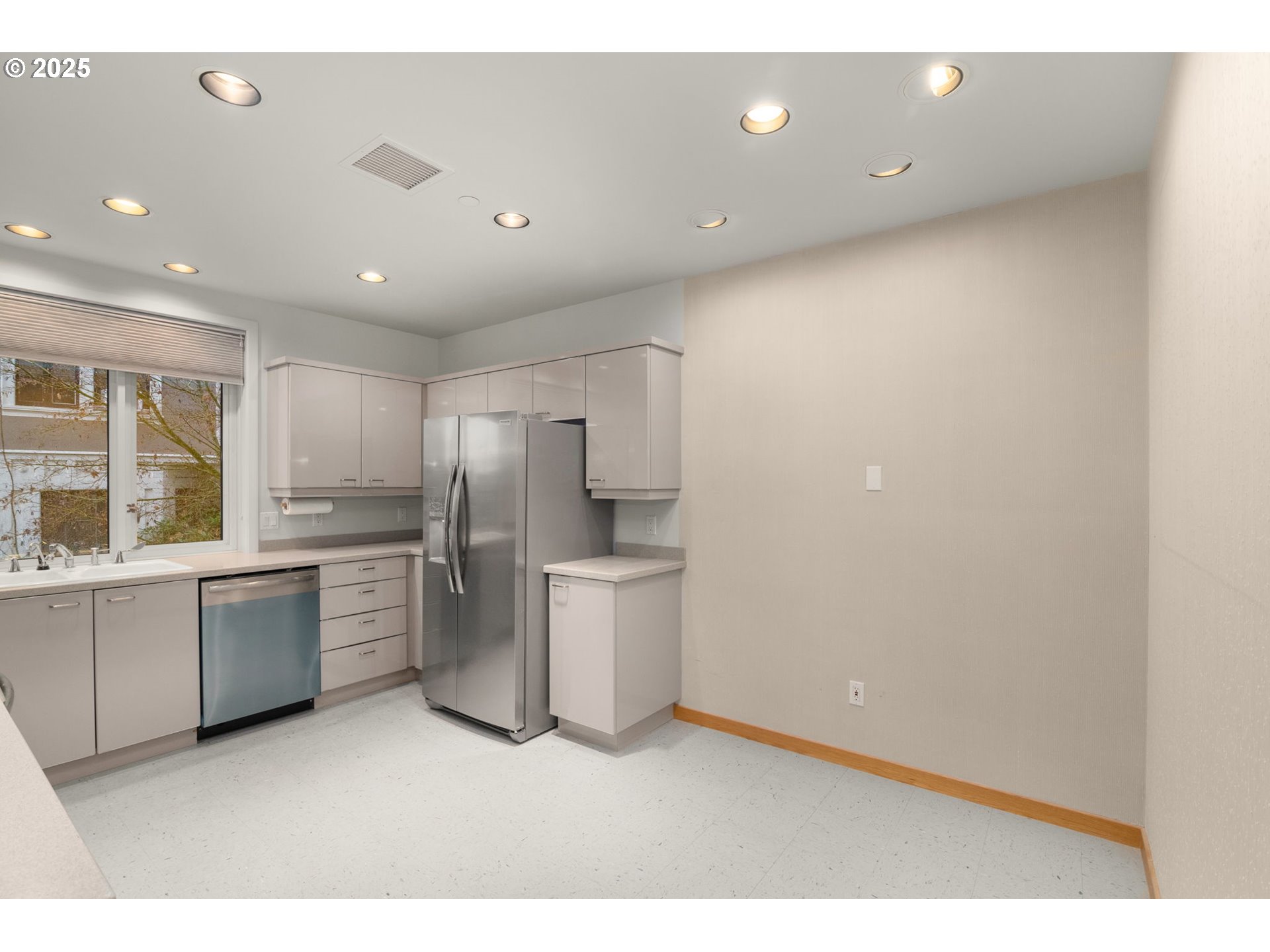 2020 Southwest Market St Drive, Unit 101 Portland, OR 97201 - Photo 15 of 33 a kitchen with refrigerator and stove