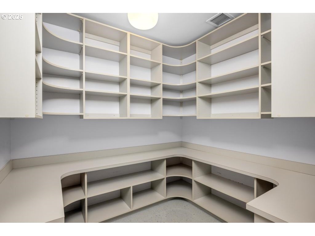 2020 Southwest Market St Drive, Unit 101 Portland, OR 97201 - Photo 17 of 33 a view of walk in closet with empty racks